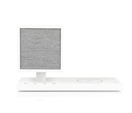 Tivoli Audio Revive Bluetooth Speaker With Wireless Charging Pad And Lamp White desktop speaker with square fabric grille on a pedestal attached to a rectangular base with a circular control ring.