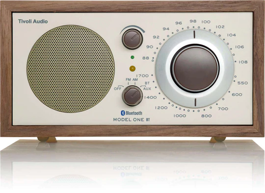 Tivoli Audio Model One Bt Bluetooth / Am / Fm Table Radio Tivoli audio model one bt wood cabinet radio with large circular tuning dial and perforated speaker grille.