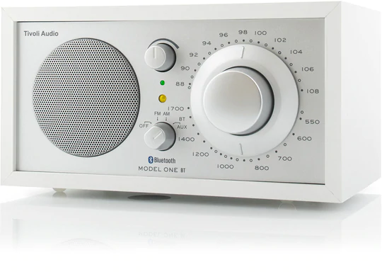 Tivoli Audio Model One Bt Bluetooth / Am / Fm Table Radio Tivoli audio model one bt white tabletop radio with circular tuner dial, front speaker grille, and bluetooth indicator.