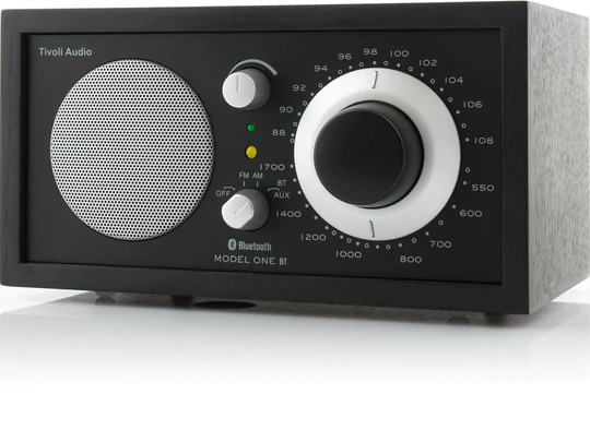 Tivoli Audio Model One Bt Bluetooth / Am / Fm Table Radio Tivoli audio model one bt tabletop radio with large analog tuning dial, speaker grille and control knobs.