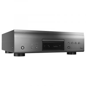 Denon slot-loading CD player with brushed metal front panel, central display, and multiple control buttons.