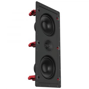 In-wall speaker with dual large woofers, central midrange driver, and red terminal posts.