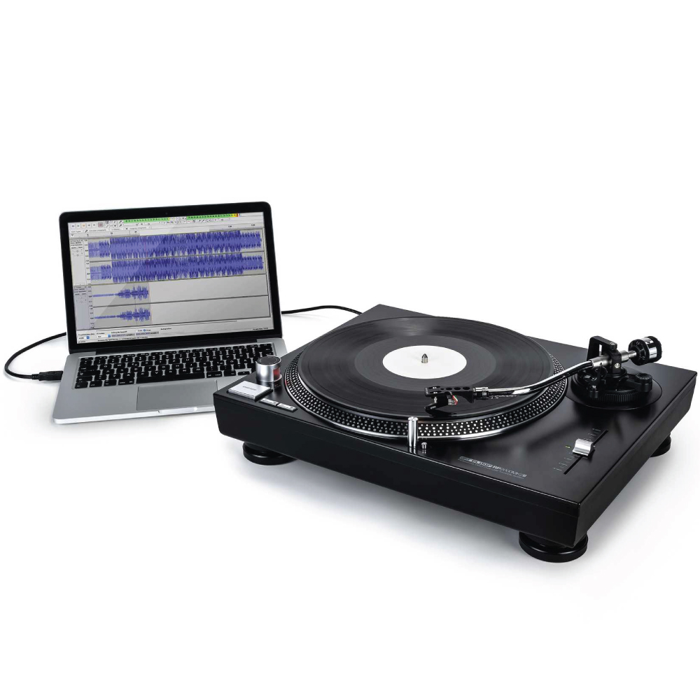 Reloop Rp-2000Mk2 Direct Drive Scratch Dj Turntable With Usb Usb-connected direct-drive turntable with tonearm and vinyl platter beside a laptop displaying audio waveforms.
