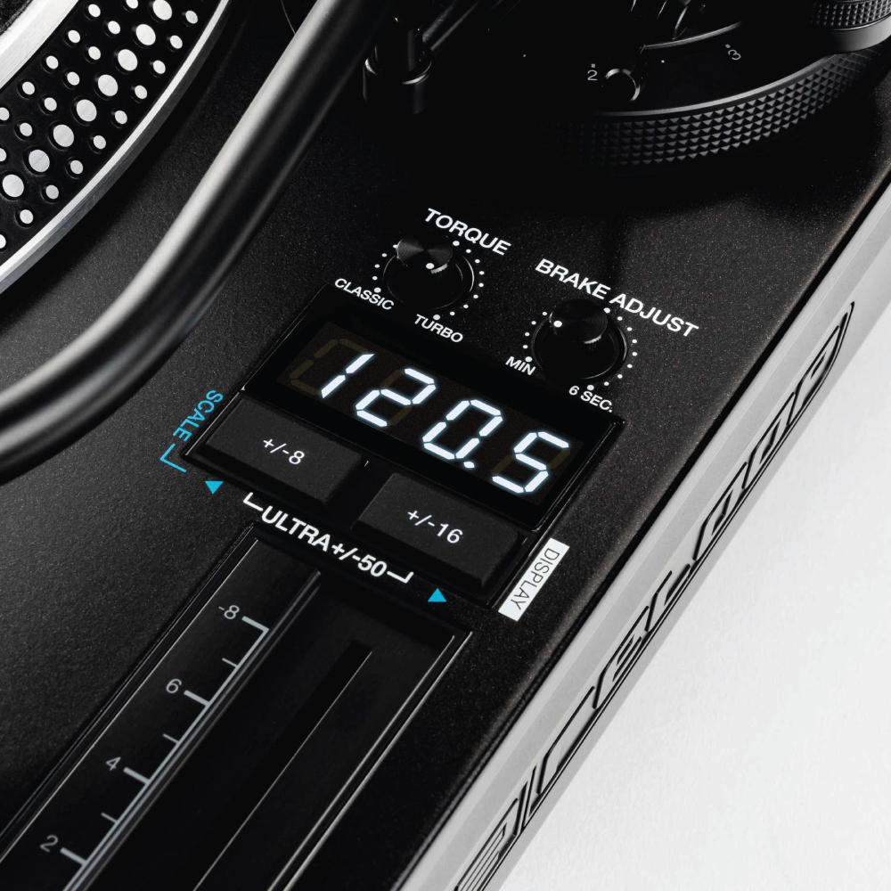 Reloop Rp-8000Mk2 Hybrid Direct Drive Dj Turntable Close-up of a black dj turntable featuring torque and brake adjustment knobs, a digital display, and a vertical scale slider.