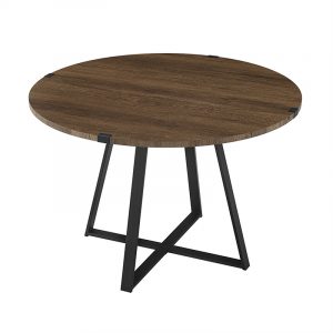 Round wooden table with dark finish and black metal X-shaped base.