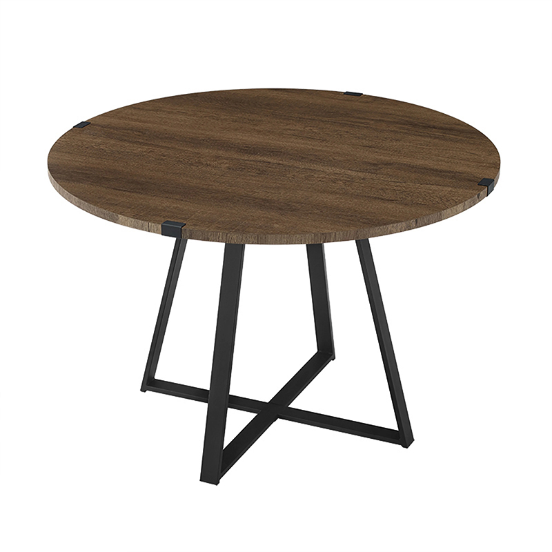 Criterion Capri Dt1100 Round wooden table with dark finish and black metal x-shaped base.