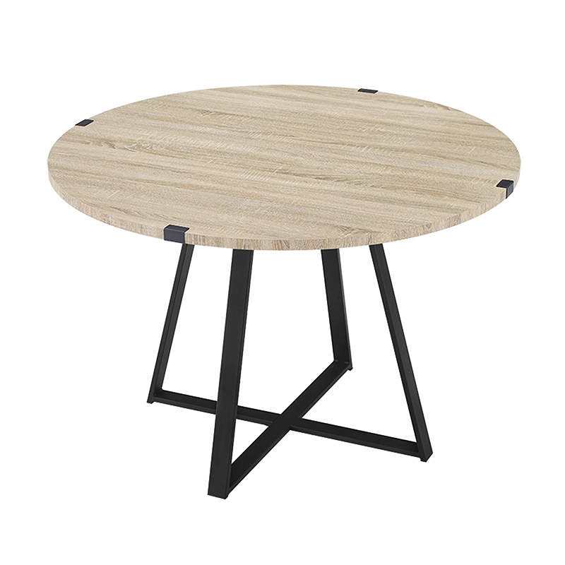 Criterion Capri Dt1100 Round light oak table with black angular metal x-frame legs.