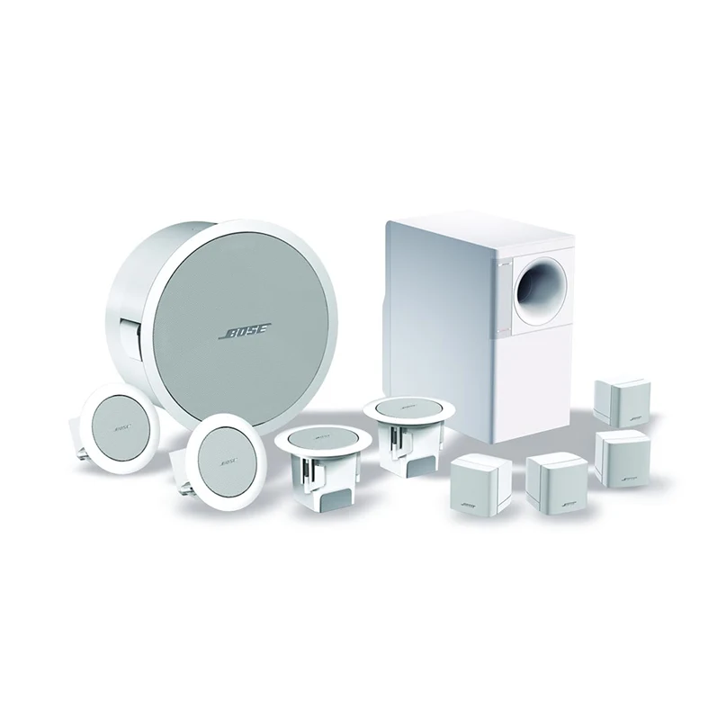 Bose Freespace 3 Flush Satellite Pair Bose 5. 1 surround sound system with round front speaker, round satellite speakers, small cube speakers, and a tall subwoofer.