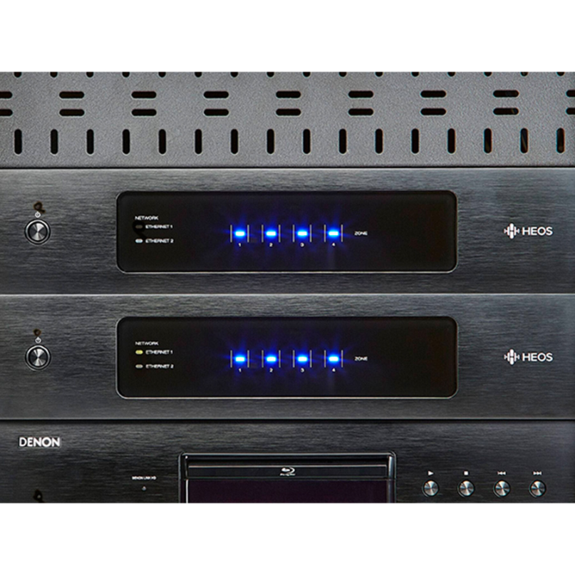 Denon Heos Drive Hs2 Amplifier Denon heos network audio players in a rack, featuring blue led meters and ethernet indicators.