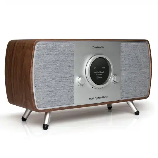 Tivoli Audio Music System Home (Gen. 2) Tivoli audio music system home stereo with wood cabinet, silver front panel, circular display, and two large gray speaker grills.