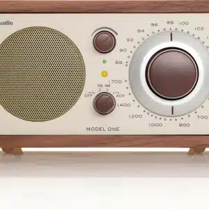 Tivoli Audio Model One wooden tabletop radio with large circular tuner dial and speaker grille.