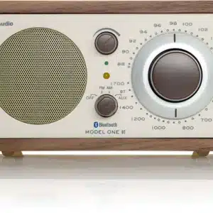 Tivoli Audio Model One BT wooden tabletop radio with large circular tuning dial and perforated speaker grille.