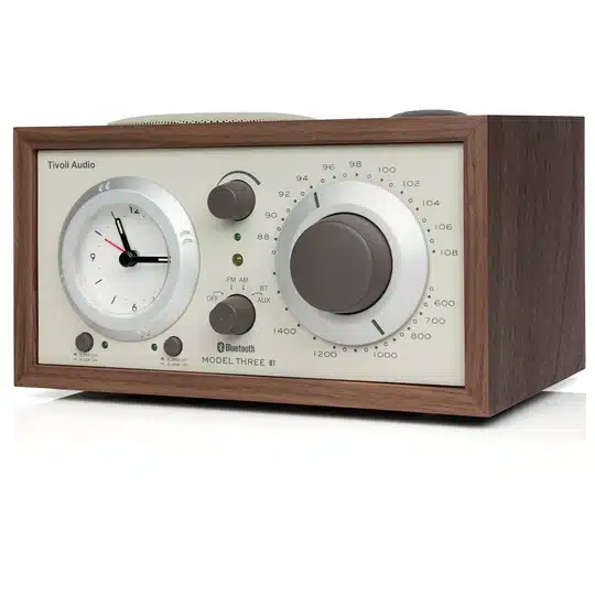Tivoli Audio Model Three Bt Tivoli audio model three bt wooden tabletop radio with large right volume dial and left clock face.