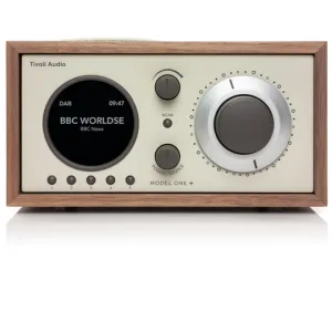Tivoli Audio Model One+ tabletop radio with a wooden cabinet, round left display and large right tuning dial.