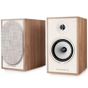 Pair of Triangle wooden bookshelf speakers with beige front panels; left unit has fabric grille, right reveals woofer and tweeter.