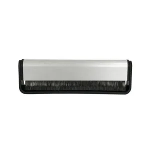 Handheld scrubbing brush with silver aluminum housing, black frame, and dense black bristles.