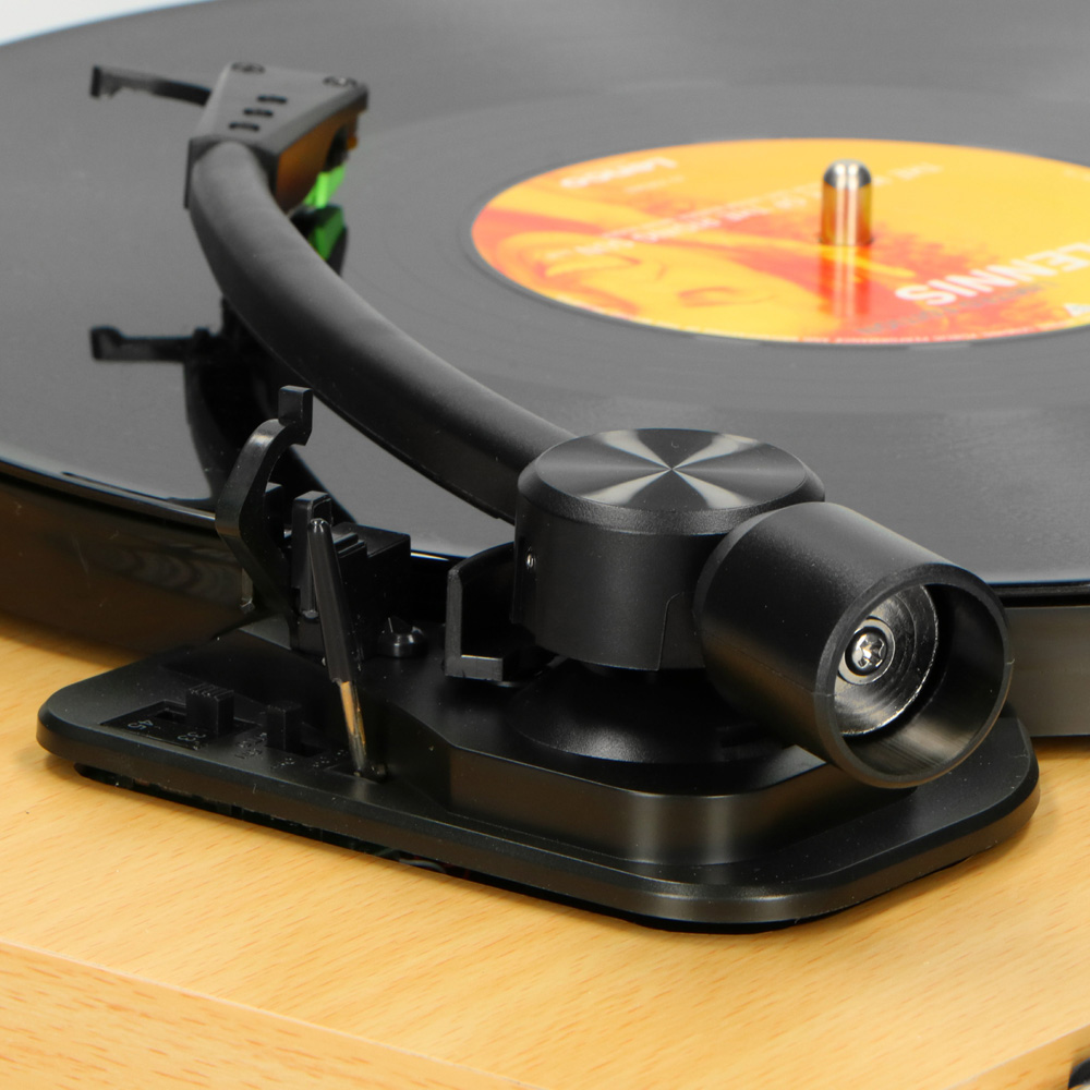 Lenco Turntable With Mmc Cartridge - Wood Close-up of a black turntable with tonearm and cartridge on a vinyl record.