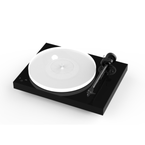 Belt-driven turntable with white platter on a black rectangular base, featuring a right-side tonearm and cartridge.