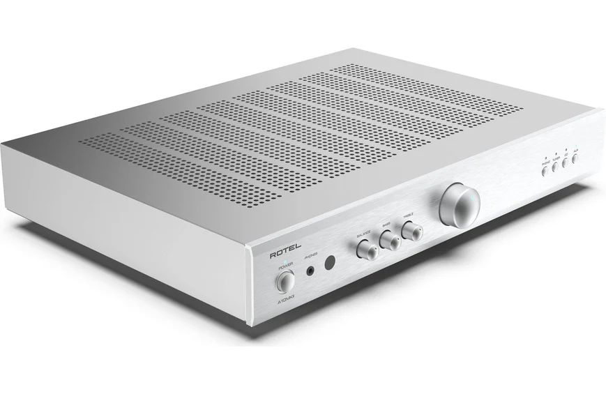 Rotel A10Mkii Integrated Amplifier Rotel silver integrated stereo amplifier with perforated top cover, panel knobs for balance, treble, bass, power, and large volume dial.