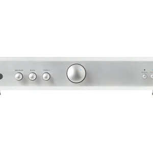 Interdyn Rotel stereo amplifier with brushed aluminum front panel, large center volume knob, and tone controls.