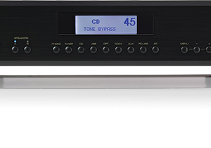 Interdyn Rotel stereo audio component with black front panel, blue display showing cd and tone bypass, multiple knobs.