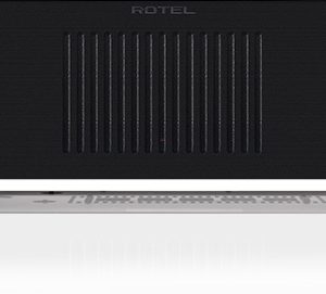 Interdyn Rotel integrated stereo amplifier front panel with blue power button and vertical ventilation slits.
