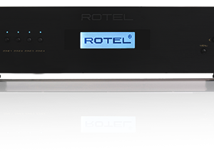 Interdyn Rotel rack-mount audio amplifier with center blue display and illuminated power ring.