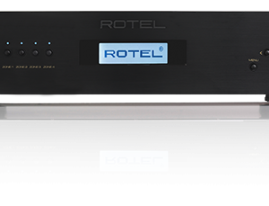 Interdyn Two rotel rack-mounted black stereo power amplifiers with blue-lit displays.