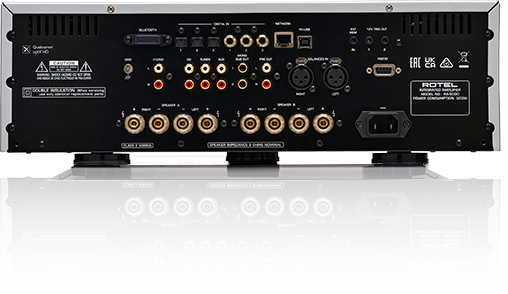Rotel Ra-6000 Integrated Amplifier Rotel power amplifier stack with multiple rca and xlr inputs, speaker outputs, and network ports on back panels.