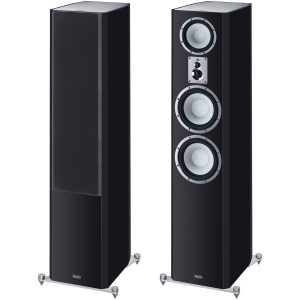Magnat floorstanding loudspeakers in black finish; right unit grille removed, exposing three white-coned drivers and a small top driver.