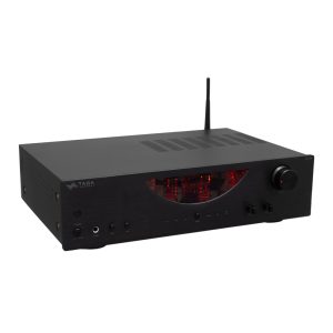 TAGA Harmony tube amplifier with glowing vacuum tubes, black brushed metal chassis, and a large right-side volume knob.