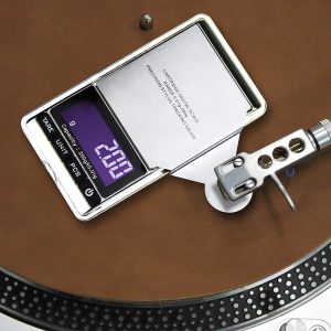 Digital scale with a stainless steel weighing pan showing 0.01 g precision and 200 g capacity on a turntable.