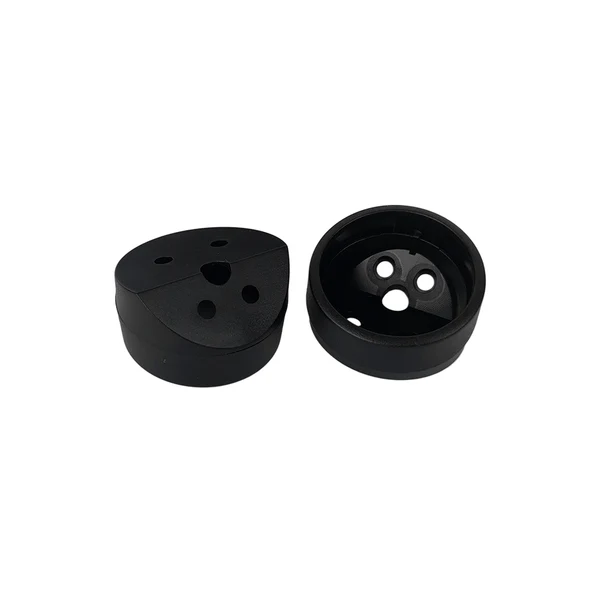 Massive Audio Toy6K Two black plastic cylindrical components forming a two-piece quick-connect coupling with multiple holes.