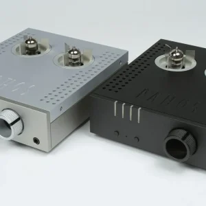 Two compact vacuum-tube audio amplifiers with dual top tubes, perforated tops, silver and black finishes, large front knobs.