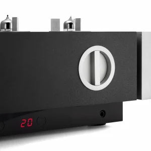 Tube audio amplifier with black matte chassis, circular white-ring dial, red LED display showing 20, and vacuum tubes on top.
