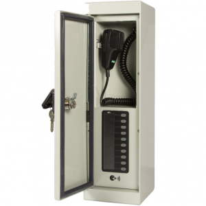 White wall-mounted intercom telephone cabinet with glass door, black handset on a coiled cord, and keypad panel.