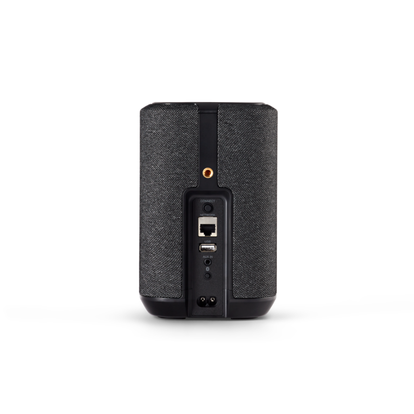 Denon Home 150 Nv Compact Speaker Wireless speaker with dark fabric cover; back panel features ethernet port, usb input, aux jack, and power connector.