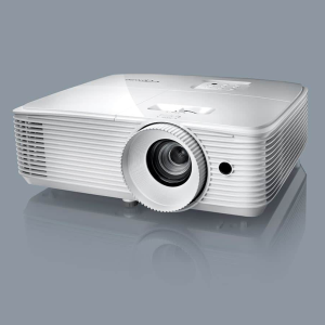 White multimedia projector with a prominent central lens, ribbed body, and top control panel.
