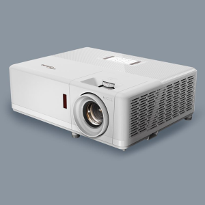 White projector with large front lens, top control dial, and side ventilation grille.
