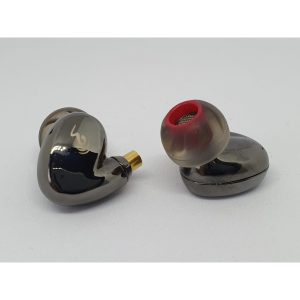Pair of smoky gray in-ear monitors with red silicone tips and gold-plated connectors.