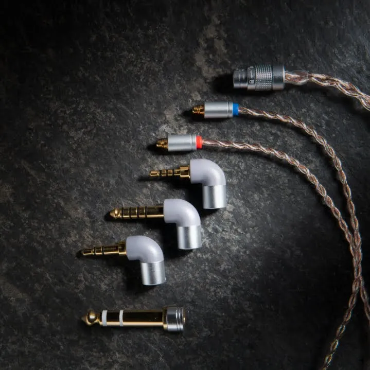 Obravo Eamt-1A Assortment of white 90-degree audio adapters with gold-plated plugs and a braided headphone cable.