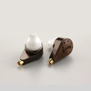 Pair of brown in-ear monitors (IEMs) with white silicone ear tips and small gold-plated connectors.