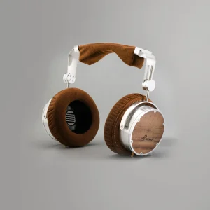 Over-ear headphones with a metal frame, brown suede padding, and wood veneer ear cups.