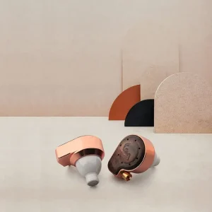 Rose-gold wireless earbuds with white silicone tips and copper housings on a beige background.