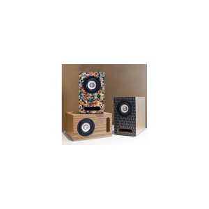 Three compact wooden speakers with circular drivers, one mosaic covered, one natural wood, and one black patterned finish.