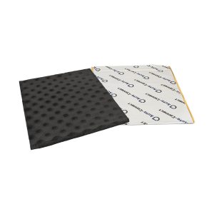Two-sided foam pad with black dotted top and white printed backing.