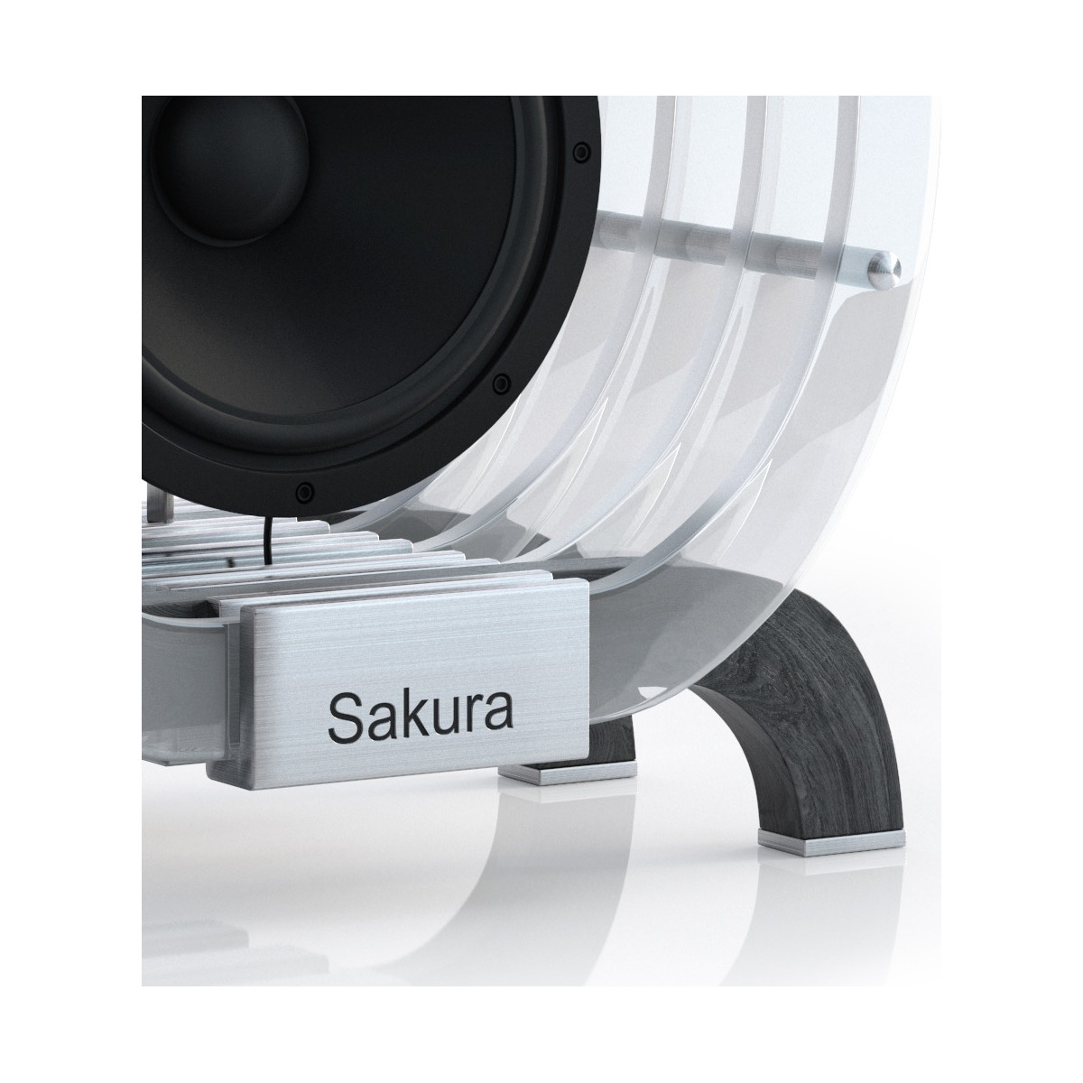 Eden Acoustics Sakura Sakura branded loudspeaker with large black woofer and clear curved panels forming a sleek enclosure.