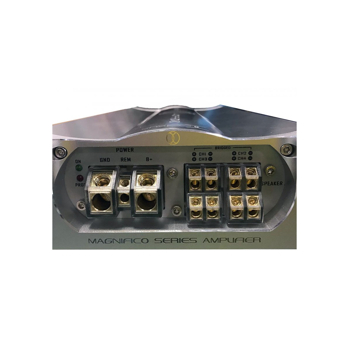 Xcelsus Audio Magn-4 Magnifico series amplifier, car audio multi-channel amplifier with power, ground, rem, b+ terminals and multiple speaker blocks.