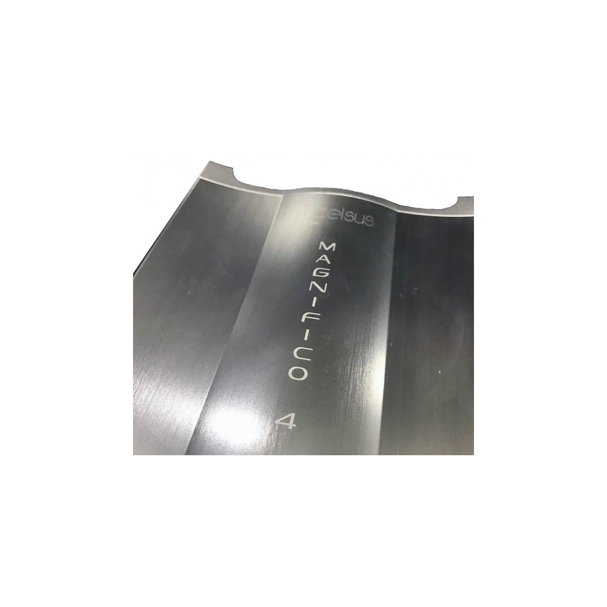 Xcelsus Audio Magn-4 Brushed stainless steel curved panel with a vertical inscription and the number 4 visible.