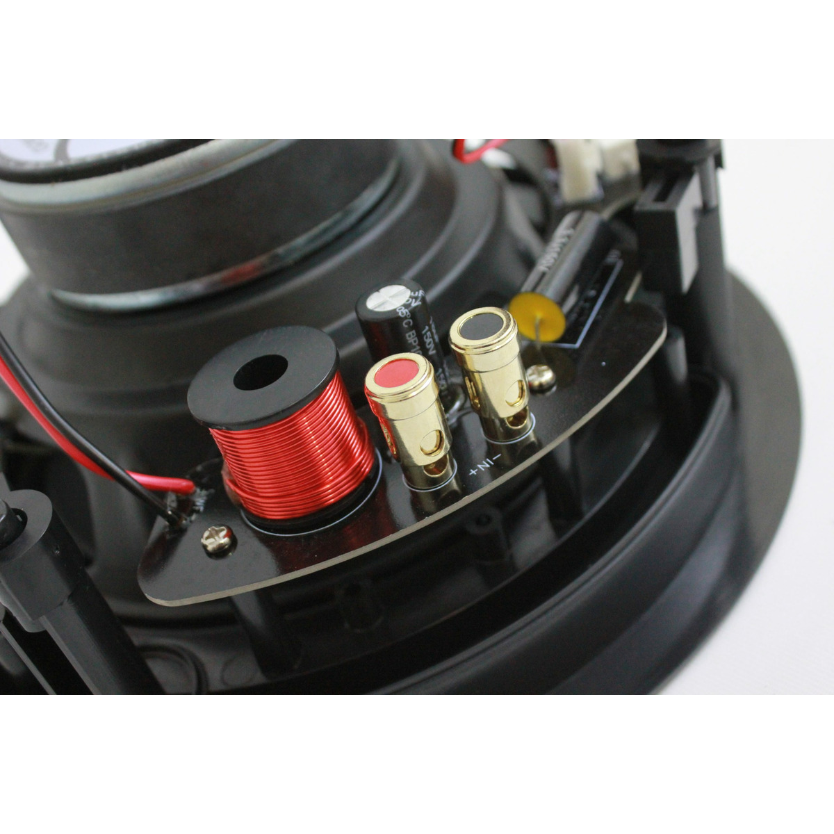 Xcelsus Audio Xic820 Loudspeaker crossover network with red coil inductor, gold binding posts, and electrolytic capacitor.
